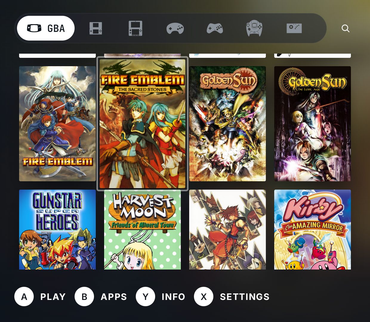 The lower panel: the whole tab as a grid of covers with the cursor framing one, the platform tabs above and the pad legend below, all under your thumb